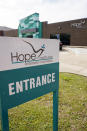 The entrance to the corporate office of Hope Enterprise Corporation, which runs a Mississippi-based credit union in Jackson, Miss., is shown Monday, Feb. 8, 2021. Hope is partnering with seven cities and nine historically Black colleges and universities to launch the “Deep South Economic Mobility Collaborative." Goldman Sachs 10,000 Small Businesses initiative is providing up to $130 million to the endeavor, which will be available to clients in Louisiana, Mississippi, Alabama, Arkansas and Tennessee. (AP Photo/Rogelio V. Solis)