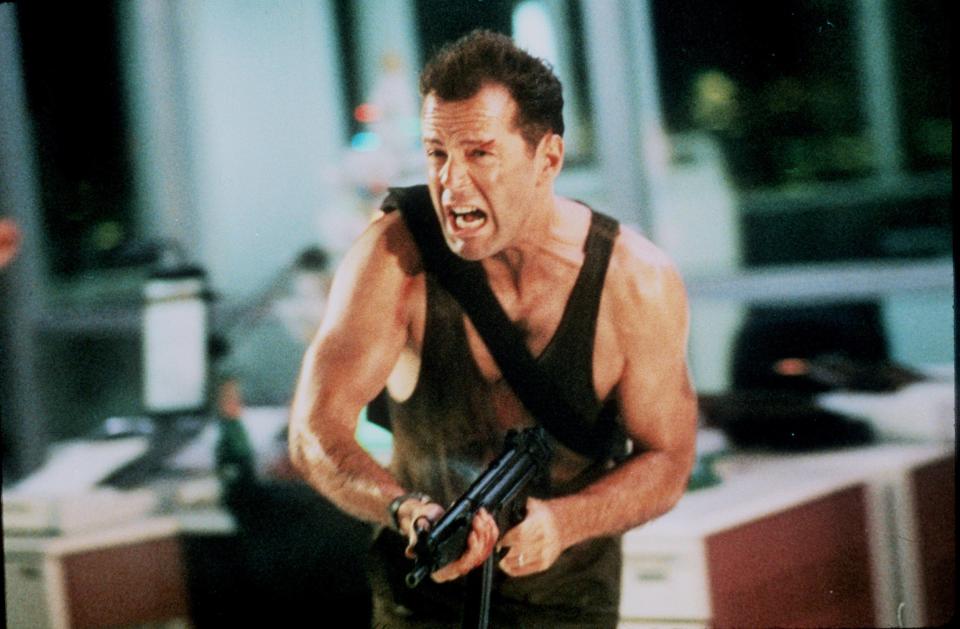 John McClane (Bruce Willis) is forced to fend off terrorists who take a corporate holiday party hostage in "Die Hard."