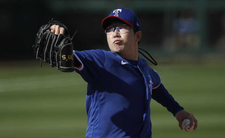 SURPRISE, ARIZONA - MARCH 07: Pitcher Hyeon-jong Yang #68 of the Texas Rangers throws against the Los Angeles Dodgers during the eighth inning of the MLB spring training baseball game at Surprise Stadium on March 07, 2021 in Surprise, Arizona. (Photo by Ralph Freso/Getty Images)