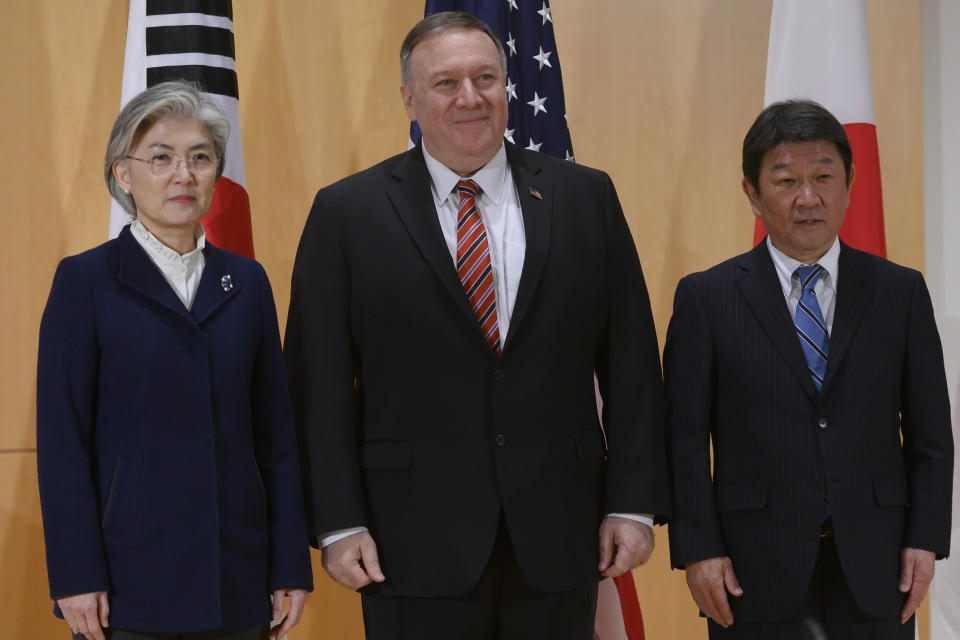 From left, South Korea's Foreign Minister Kang Kyung-wha, U.S. Secretary of State Mike Pompeo and Japan's Foreign Minister Toshimitsu Motegi pose during a trilateral meeting during the 56th Munich Security Conference (MSC) in Munich, southern Germany Saturday, Feb. 15, 2020. (Andrew Caballero-Reynolds/Pool Photo via AP)