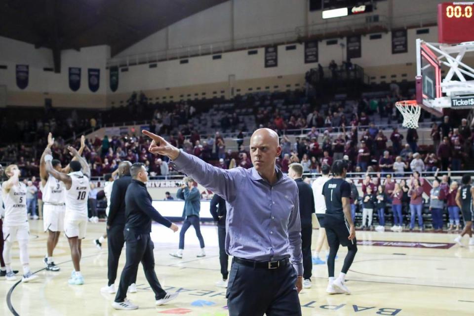 Eastern Kentucky head coach A.W. Hamilton acknowledges fans after his team defeated North Alabama during an ASUN Tournament quarterfinal game in Richmond on Feb. 28. Hamilton is entering his sixth season as the head coach at EKU.