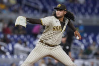 San Diego Padres starting pitcher Sean Manaea aims a pitch during the first inning of a baseball game against the Miami Marlins, Tuesday, Aug. 16, 2022, in Miami. (AP Photo/Marta Lavandier)