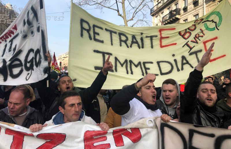 French labour union members and workers on strike attend a demonstration in Paris