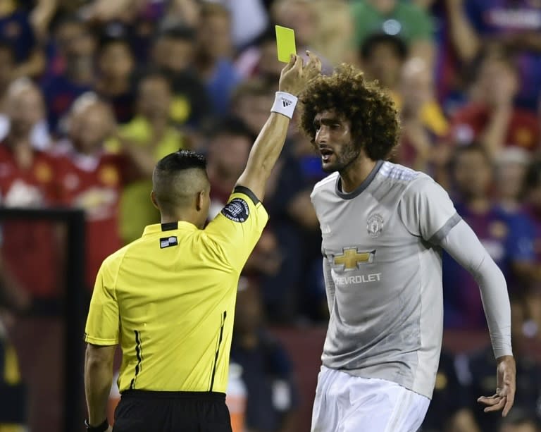 Marouane Fellaini of Manchester United is given a yellow card during their International Champions Cup (ICC) friendly match against Barcelona, at the FedExField in Landover, Maryland, on July 26, 2017