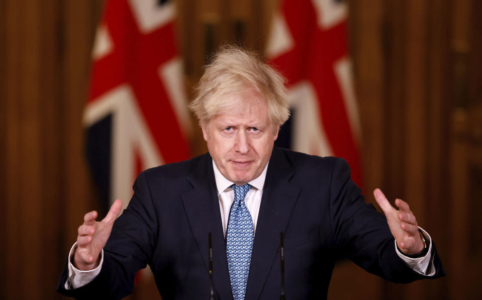 Britain's Prime Minister Boris Johnson speaks during a media briefing in Downing Street, London, Monday Dec. 21, 2020. (Tolga Akmen/Pool via AP)