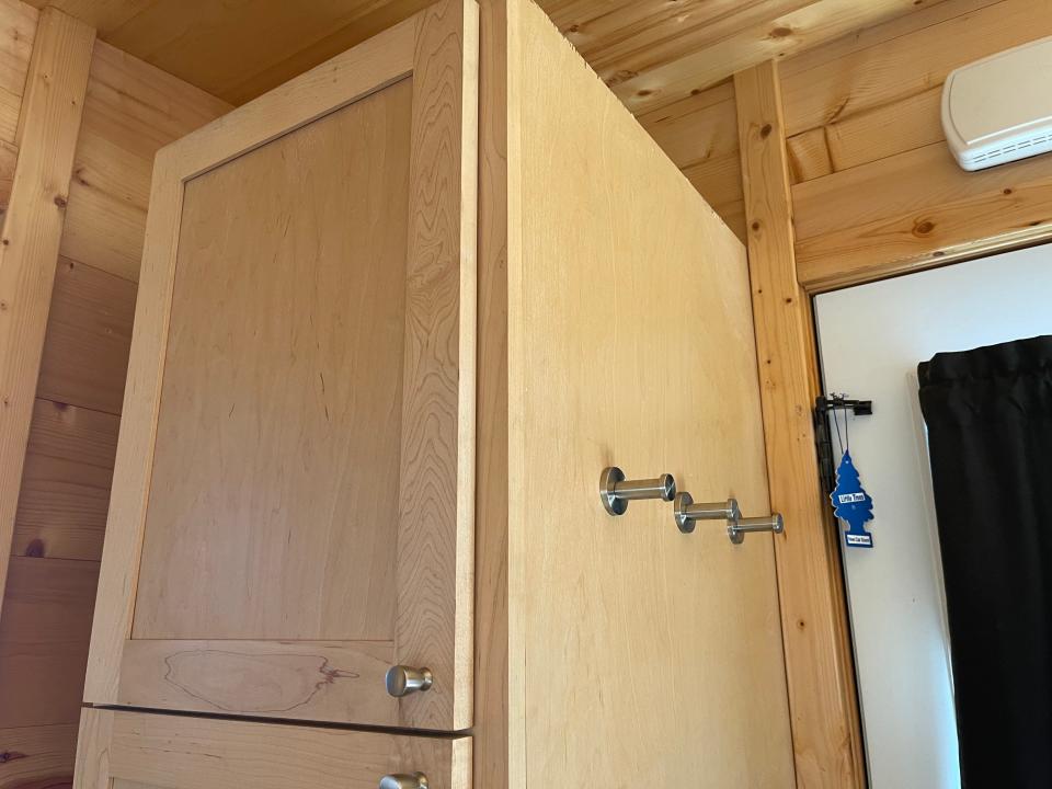 closet with hooks in a tiny home airbnb near disneyland