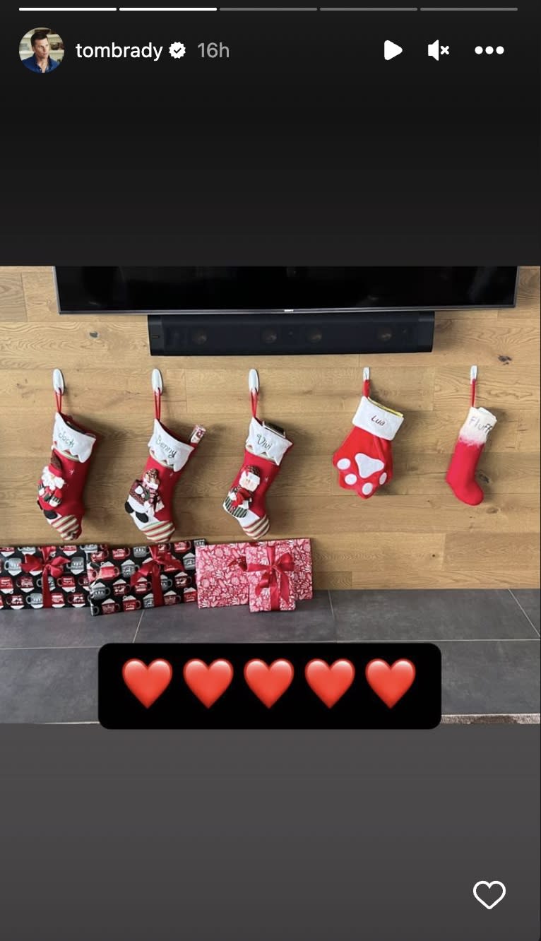 Tom Brady shows off stockings for the kids.