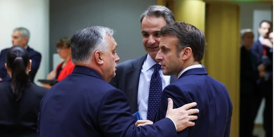 Hungarian Prime Minister Viktor Orban talks with French President Emmanuel Macron and Greek Prime Minister Kyriakos Mitsotakis at the EU summit in Brussels, December 14, 2023