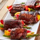 <p>Balsamic glazed steaks get rolled around fresh veggies for the perfect combo. It's a fun appetiser or an easy summer dinner. Securing the roll-ups with toothpicks makes them MUCH easier to cook. Just don't forget to remove them when it's time for serving! </p><p>Get the <a href="https://www.delish.com/uk/cooking/recipes/a35261967/balsamic-steak-roll-ups-recipe/" rel="nofollow noopener" target="_blank" data-ylk="slk:Balsamic Steak Rolls-Ups;elm:context_link;itc:0;sec:content-canvas" class="link ">Balsamic Steak Rolls-Ups</a> recipe.</p>