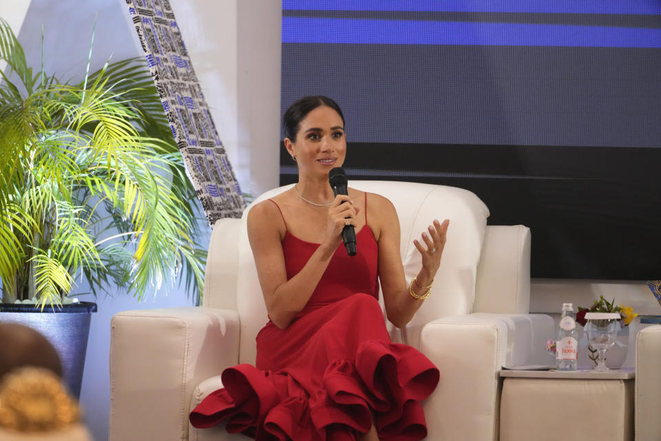 Meghan, the Duchess of Sussex, speaks at an event in Abuja, Nigeria, Saturday, May 11, 2024. Meghan, the Duchess of Sussex, says it’s been “humbling” to find out through a genealogy test that she is partly Nigerian. She was speaking at a meeting with Nigerian female industry leaders at an event on Saturday, her second day in the West African nation where she is visiting with Harry, her husband. (AP Photo/Sunday Alamba)
