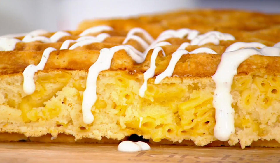 close up of mac and cheese waffle drizzled with ranch