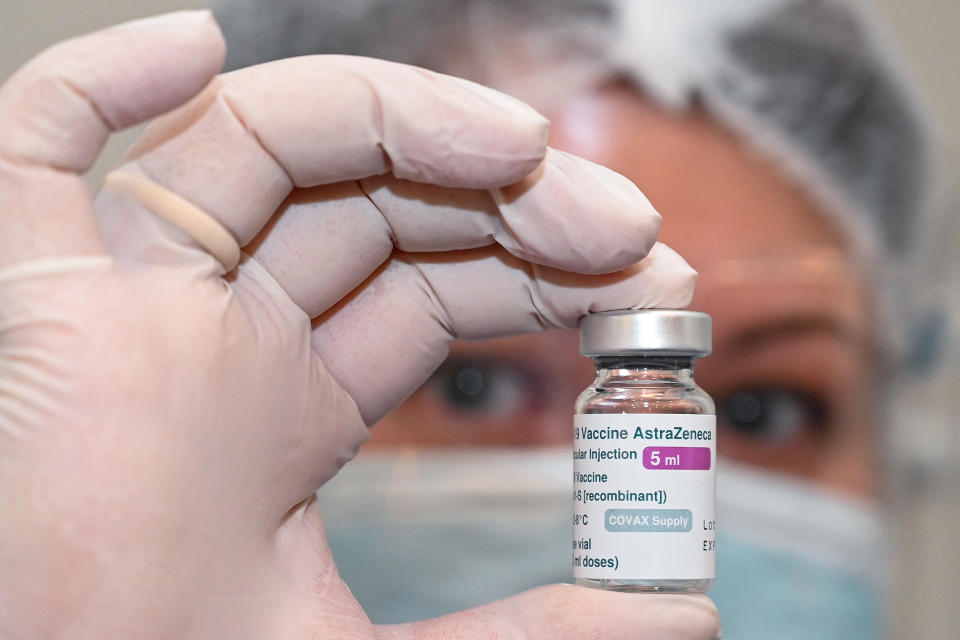 A nurse holds a vial of the Oxford-AstraZeneca vaccine against the coronavirus disease at an infectious diseases hospital in Tbilisi on March 15, 2021. (Photo by Vano SHLAMOV / AFP) (Photo by VANO SHLAMOV/AFP via Getty Images)