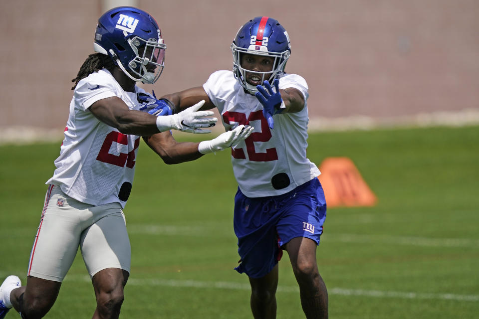 New York Giants cornerbacks Adoree' Jackson, right, fends off cornerback Logan Ryan, left, as they go through a drill during an NFL football practice, Thursday, June 10, 2021, in East Rutherford, N.J. (AP Photo/Kathy Willens)