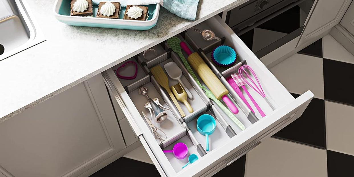 kitchen drawer with utensils in different divided sections