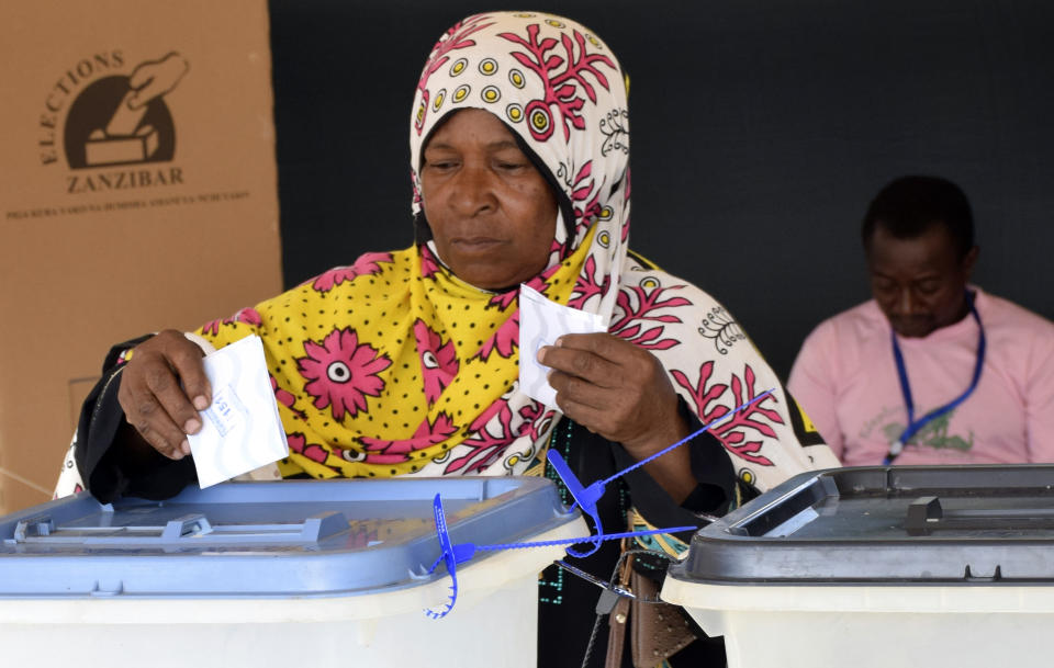 Locals cast their votes in Zanzibar, Tanzania, Wednesday. Oct.28, 2020. Tanzania's other top opposition party, ACT Wazalendo, accused police of shooting dead nine people in the semi-autonomous region of Zanzibar. (AP Photo)