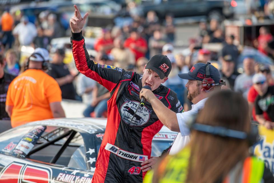 Derik Thorn speaks to the crowd after the 54th annual Snowball Derby at Five Flags Speedway Sunday, December 5, 2021.