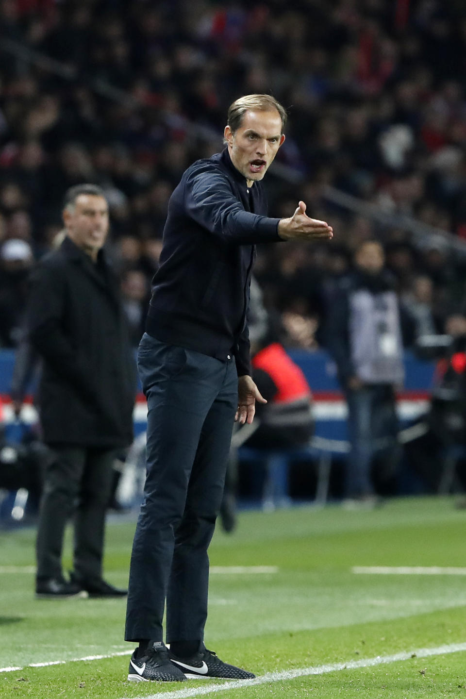 PSG's coach Thomas Tuchel shouts as he gives instructions to his players during the League One soccer match between Paris Saint-Germain and Lille at the Parc des Princes stadium in Paris, Friday, Nov. 2, 2018. (AP Photo/Thibault Camus)