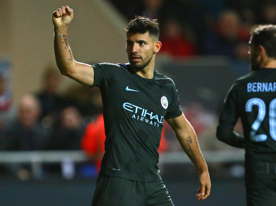 Sergio Aguero celebrates firing home City's second goal: Getty