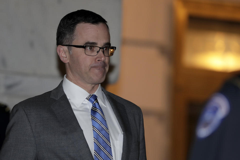 Tim Morrison, a former official at the National Security Council, leaves after testifying before the House Intelligence Committee on Capitol Hill in Washington, Tuesday, Nov. 19, 2019, during a public impeachment hearing of President Donald Trump's efforts to tie U.S. aid for Ukraine to investigations of his political opponents. (AP Photo/Julio Cortez)