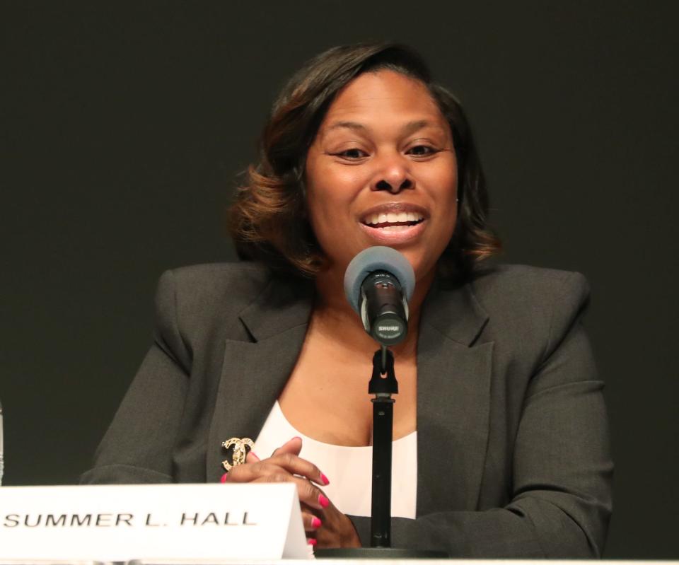 School board candidate Summer L. Hall answers a question during the Akron City School Board Candidate Forum at the Akron-Summit County Library in Akron.