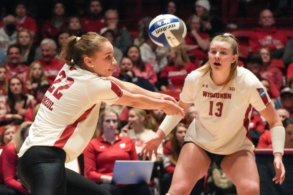 Wisconsin sophomore Julia Orzol (22) returns the ball during their third set in the 2022 NCAA volleyball tournament Sweet 16 women's volleyball match Thursday, Dec. 8, 2022, at UW Field House in Madison, Wis.