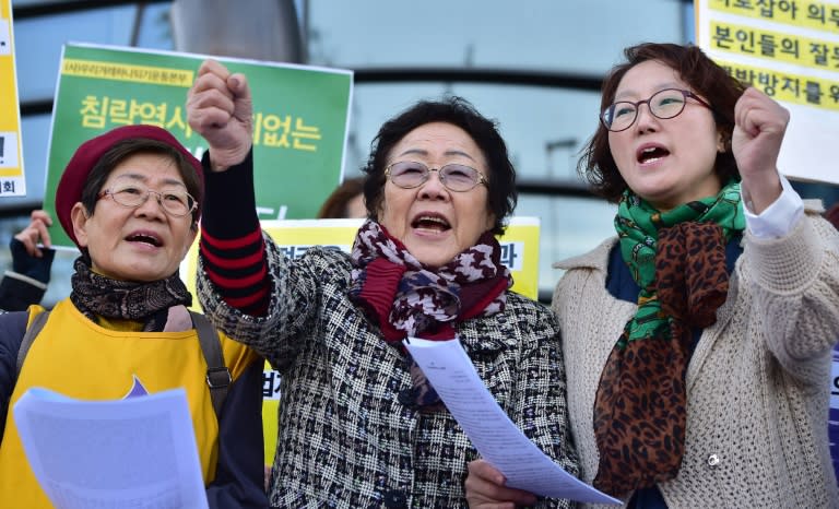 South Korean former "comfort woman" Lee Yong-Soo (C), who was forcibly recruited to work in Japanese wartime brothels, and supporters demonstrate near the Japanese embassy in Seoul on October 30, 2015