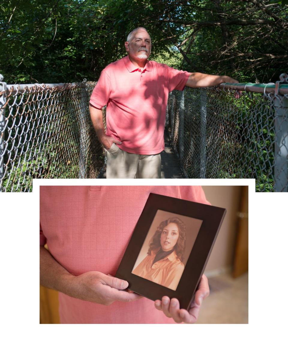 a man standing between two chain fences and same man holding portrait of his late wife