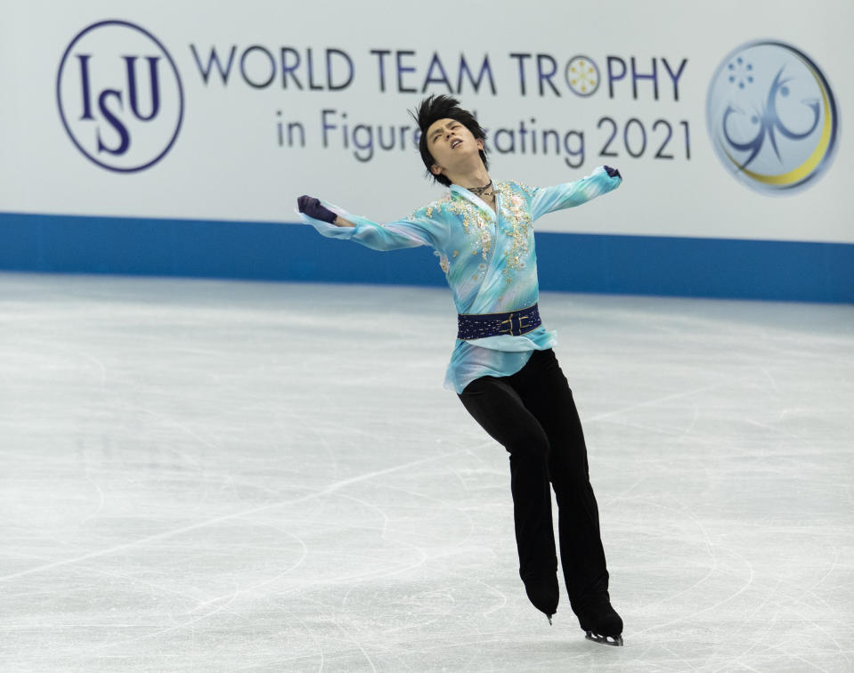 Japan's Yuzuru Hanyu performs during the men's free skating program of the ISU World Team Trophy figure skating competition in Osaka, western Japan, Friday, April 16, 2021. (AP Photo/Hiro Komae)