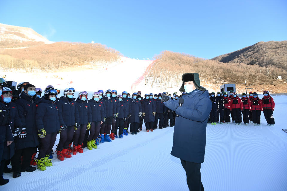 FILE - In this Jan. 18, 2020, file photo released by China's Xinhua News Agency, Chinese President Xi Jinping speaks with athletes and coaches at the National Alpine Skiing Center in Yanqing on the outskirts of Beijing during a tour of venues and preparations for the 2022 Beijing Winter Olympics. The 2022 Beijing Winter Olympics will open a year from now. Most of the venues have been completed as the Chinese capital becomes the first city to hold both the Winter and Summer Olympics. Beijing held the 2008 Summer Olympics. But these Olympics are presenting some major problems. They are already scarred by accusations of rights abuses including "genocide"against more than 1 million Uighurs and other Muslim ethnic groups in western China. (Ju Peng/Xinhua via AP, File)