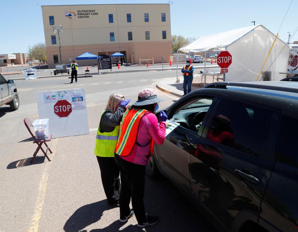 Staff at the Tuba City Regional Health Care Center screen people entering their campus on April 14, 2020. The hospital on the Navajo Reservation in Arizona has seen a spike in COVID-19 cases.