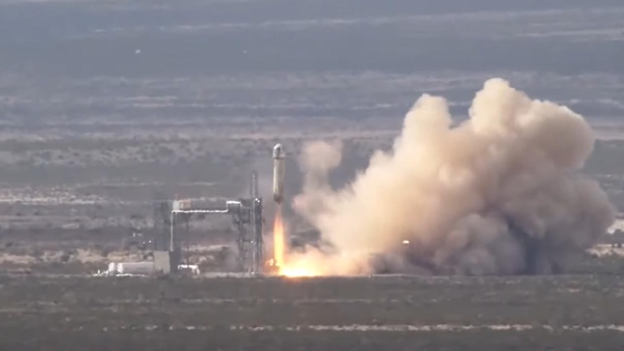  Rocket launching above a desert. 