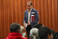 Members of the Interdisciplinary Group of Independent Experts (GIEI), speak to relatives during a news conference in Mexico City