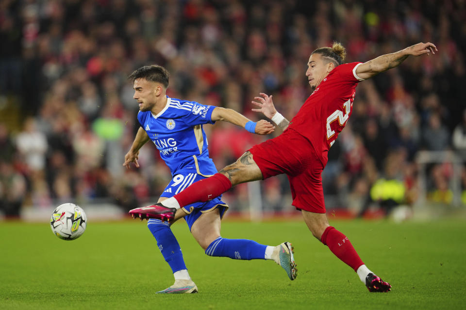 Leicester's Yunus Akgun, left, is challenged by Liverpool's Kostas Tsimikas during the English League Cup third round soccer match between Liverpool and Leicester City at the Anfield stadium in Liverpool, England, Wednesday, Sept. 27, 2023. (AP Photo/Jon Super)