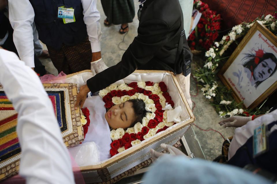 Mya Thwet Thwet Khine, lies in a coffin during her funeral in Naypyitaw, Myanmar, Sunday, Feb. 21 2021. Mya Thwet Thwet Khine was the first confirmed death among the many thousands who have taken to the streets to protest the Feb. 1 coup that toppled the elected government of Aung San Suu Kyi. The woman was shot on Feb. 9, two days before her 20th birthday, at a protest in the capital Nayptitaw, and died Friday. (AP Photo)