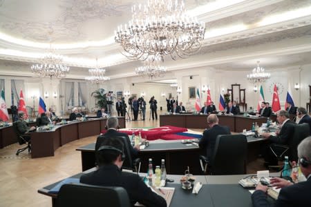 Turkish President Tayyip Erdogan speaks during a meeting with his counterparts Putin of Russia and Rouhani of Iran in Ankara