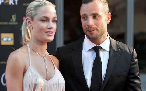 Oscar Pistorius and Reeva Steenkamp in November 2012, three months before he killed her - Credit: LUCKY NXUMALO/AFP