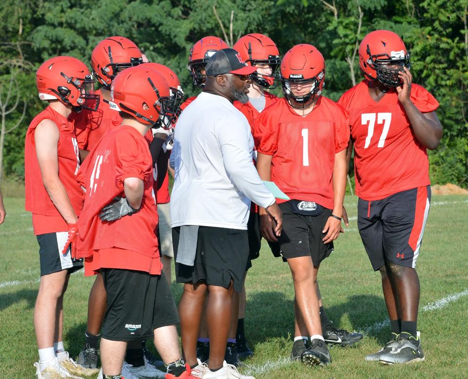 The North Hagerstown football team gets instructions during the first practice of the season.
