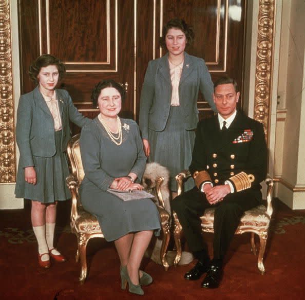 <p>The King and Queen pose with Princesses Margaret and Elizabeth. This year, tragedy hits when Prince George, Duke of Kent (King George's brother) is killed in active service only weeks after his son Michael is born. </p>