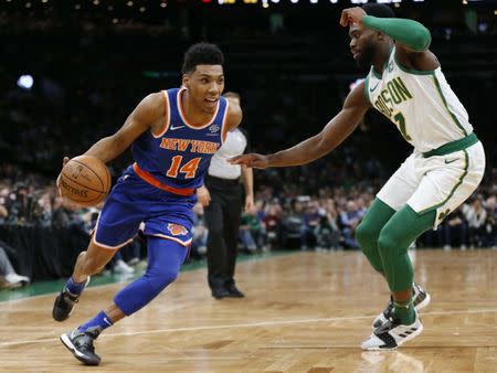 Dec 6, 2018; Boston, MA, USA; New York Knicks guard Allonzo Trier (14) is guarded by Boston Celtics guard Jaylen Brown (7) during the first half at TD Garden. Greg M. Cooper-USA TODAY Sports