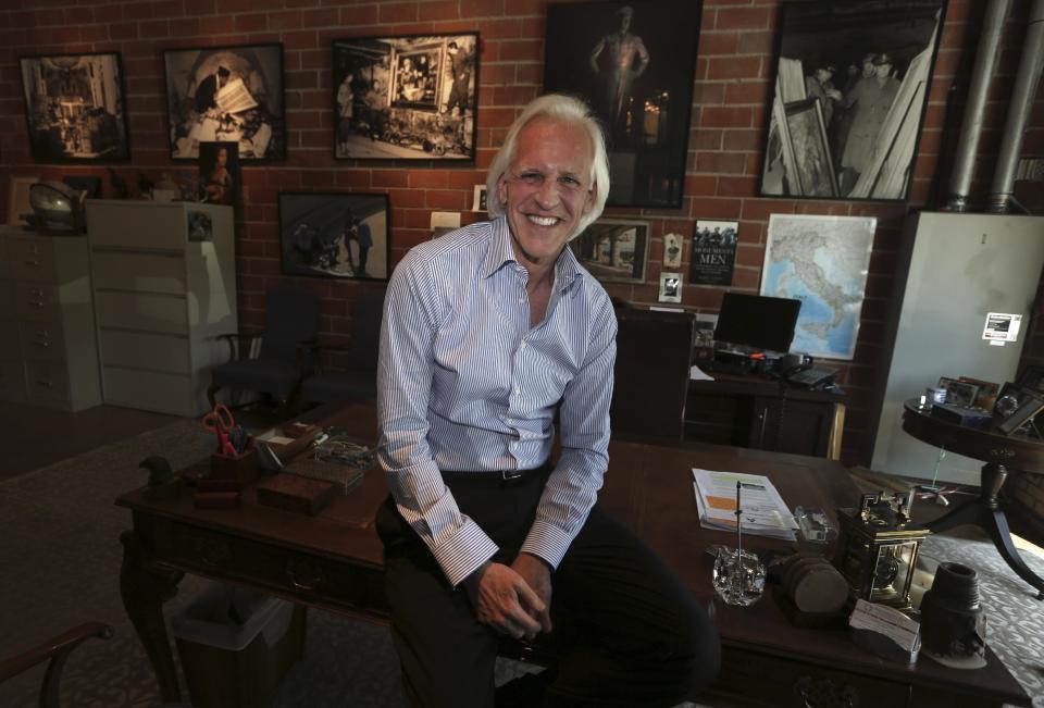 In this photo taken April 29, 2013, Robert Edsel, founder of the Monuments Men Foundation for the Preservation of Art, poses for a photo at his organization's office in Dallas. Edsel started his foundation in 2007 to honor and continue the work of the Monuments Men, the roughly 345 men and women from 13 nations who helped protect cultural treasures during World War II. (AP Photo/LM Otero)