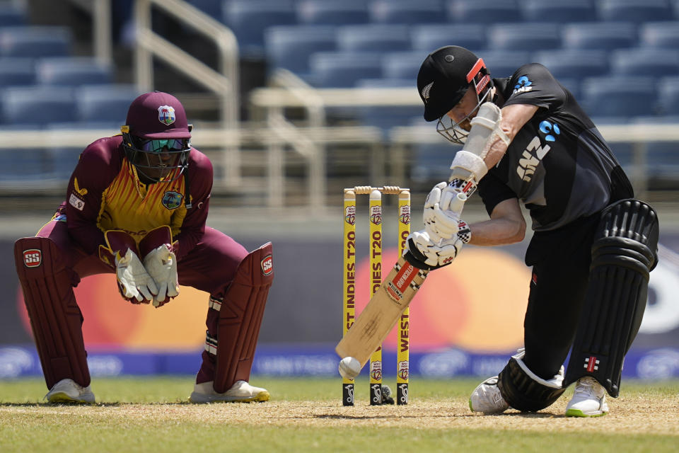 New Zealand's captain Kane Williamson plays a shot against the West Indies during the third T20 cricket match at Sabina Park in Kingston, Jamaica, Sunday, Aug. 14, 2022. (AP Photo/Ramon Espinosa)