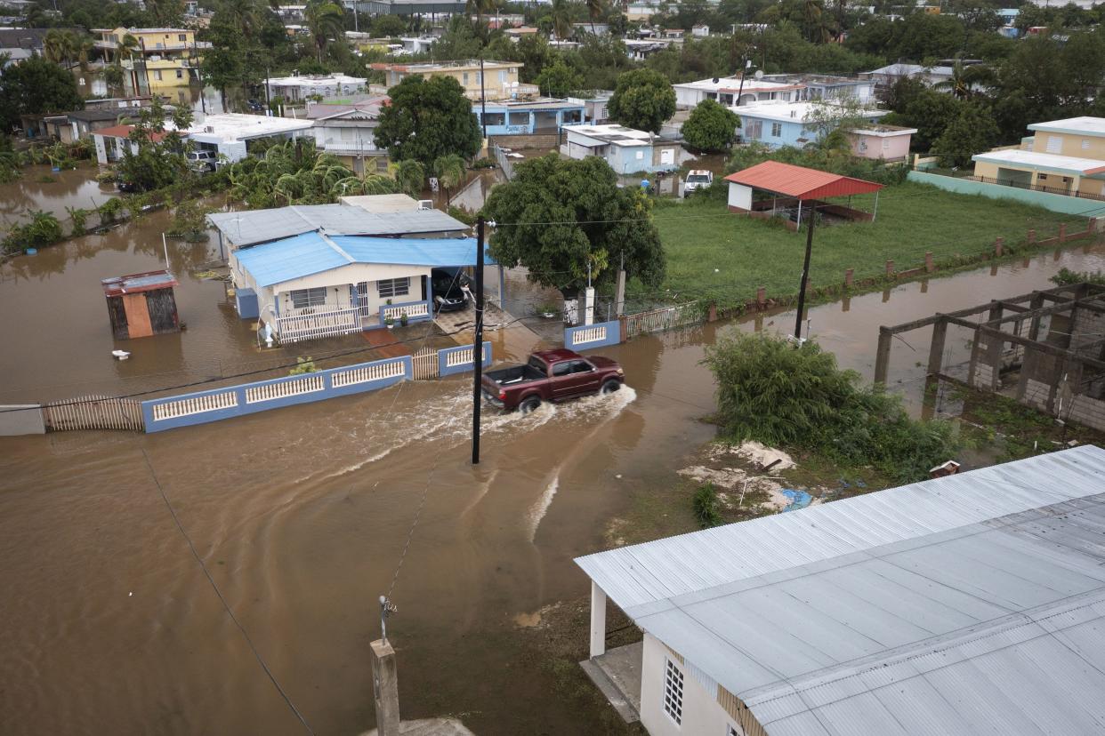 Streets are flooded on Salinas Beach after the passing of Hurricane Fiona in Salinas, Puerto Rico, Monday, Sept. 19, 2022.