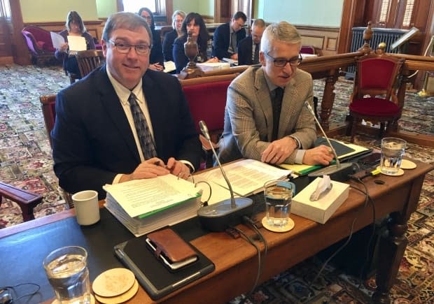 Eric Beaulieu, deputy minister of the Department of Social Development, left, was questioned on his department's handling of a number of files, including the improvement of conditions for youth in group homes.  (Jacques Poitras/CBC - image credit)