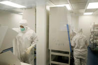 Employees are seen inside the "clean room" at the laboratory in Israeli biotech firm Bonus Biogroup in Haifa, Israel December 4, 2016. REUTERS/Baz Ratner