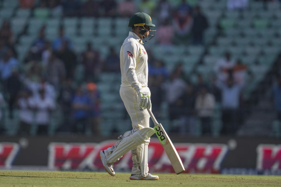 Australia's Usman Khawaja, walks back after losing his wicket during the first day of the first cricket test match between India and Australia in Nagpur, India, Thursday, Feb. 9, 2023. (AP Photo/Rafiq Maqbool)