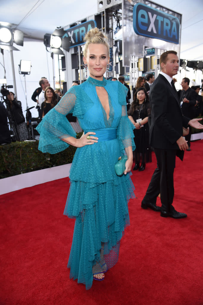 <p>Sims rocked a tiered turquoise gown with purple Stuart Weitzman heels. (Photo: Getty Images) </p>