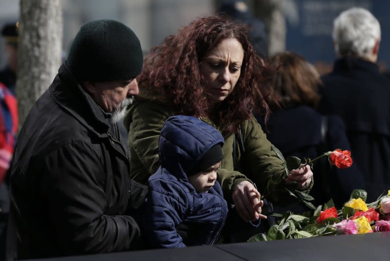 Mourners lay flowers at the Reflecting Pools on February 26 at the annual remembrance ceremony at the National September 11 Memorial & Museum to commemorate the 26th anniversary of the 1993 World Trade Center bombing that killed six and injured over 1,000 on in New York City. On March 4, 1994, four men were found guilty in the bombing. Photo by John Angelillo/UPI