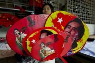 Various fans with portraits of Myanmar opposition leader Aung San Suu Kyi are seen for sale outside the National League for Democracy (NLD) party headquarters in Yangon on November 11, 2015