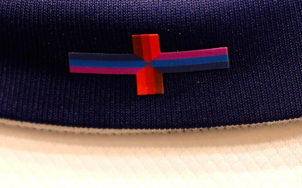 The altered design of the St George's Cross on the new England shirt seen for sale in the club shop