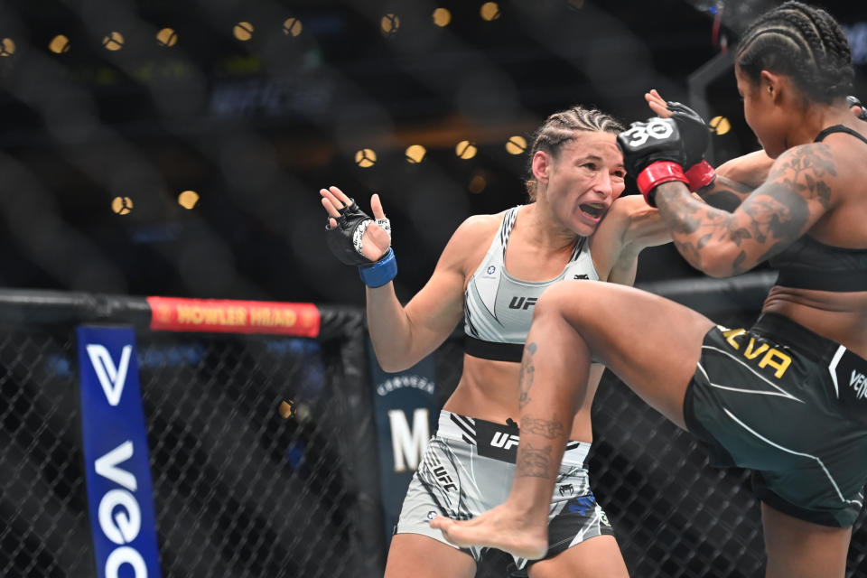 Aug 19, 2023; Boston, MA, USA; Karine Silva (red gloves) fights Marina Moroz (blue gloves) during UFC 292 at TD Garden. Mandatory Credit: Bob DeChiara-USA TODAY Sports